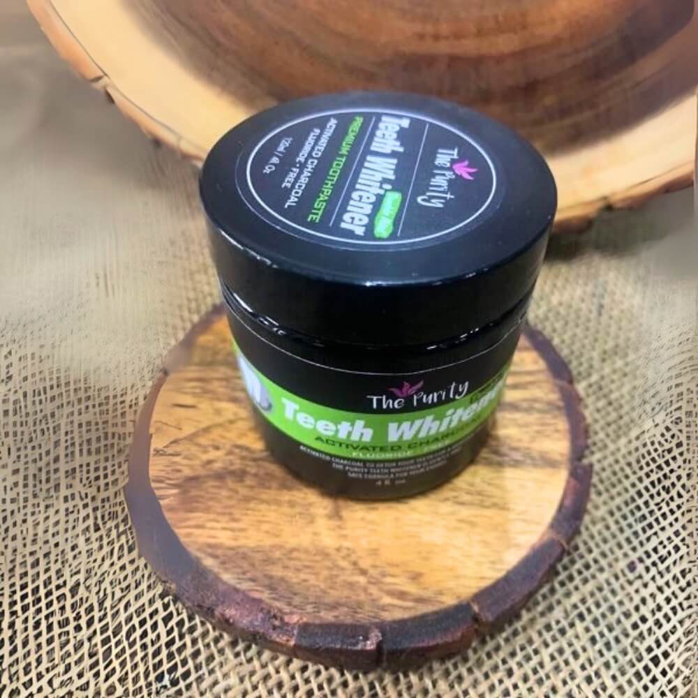 Jar of black activated charcoal teeth whitening powder