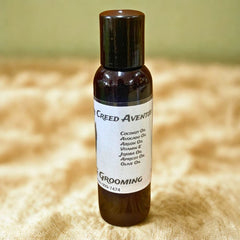 Seyni’s Creed Aventus Beard Oil bottle with a masculine dropper design.